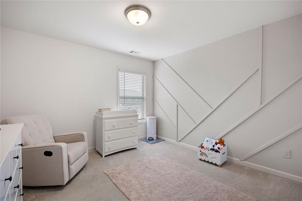 641 Little Bear Loop Canton, GA 30114 - Photo 23 of 37 a view of a room with baby crib