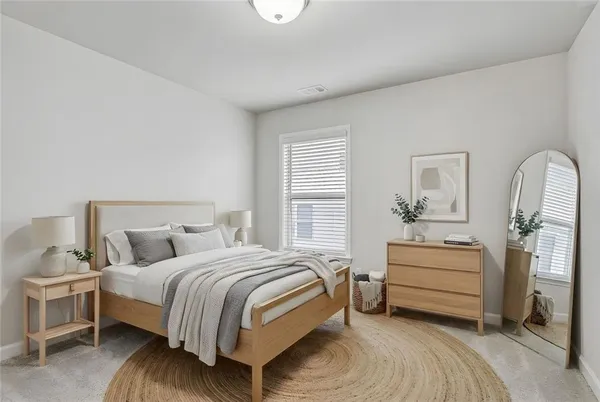 a bedroom with a bed and a dresser