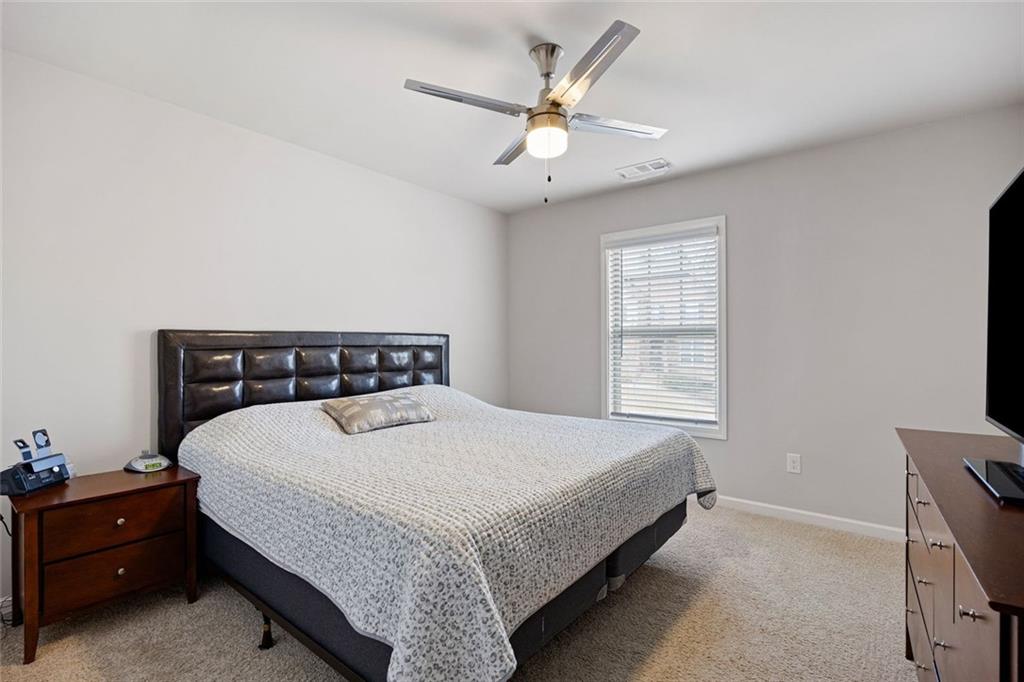 641 Little Bear Loop Canton, GA 30114 - Photo 26 of 37 a bedroom with a bed and window