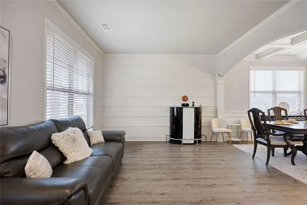 a view of a livingroom with furniture and windows