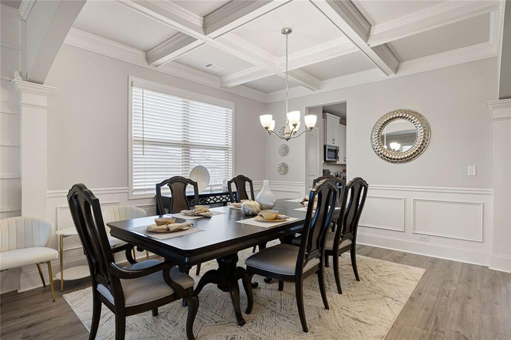 641 Little Bear Loop Canton, GA 30114 - Photo 6 of 37 a view of a dining room with furniture and chandelier