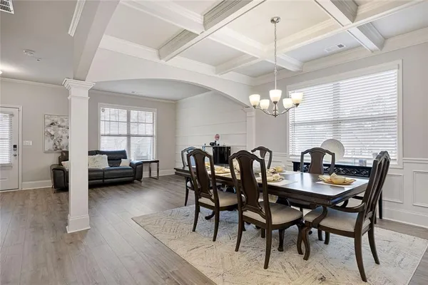 a view of a dining room with furniture and window