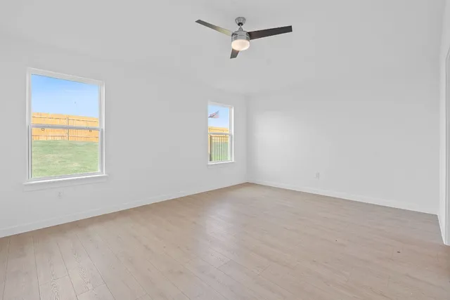 a kitchen with stainless steel appliances a sink a stove and cabinets