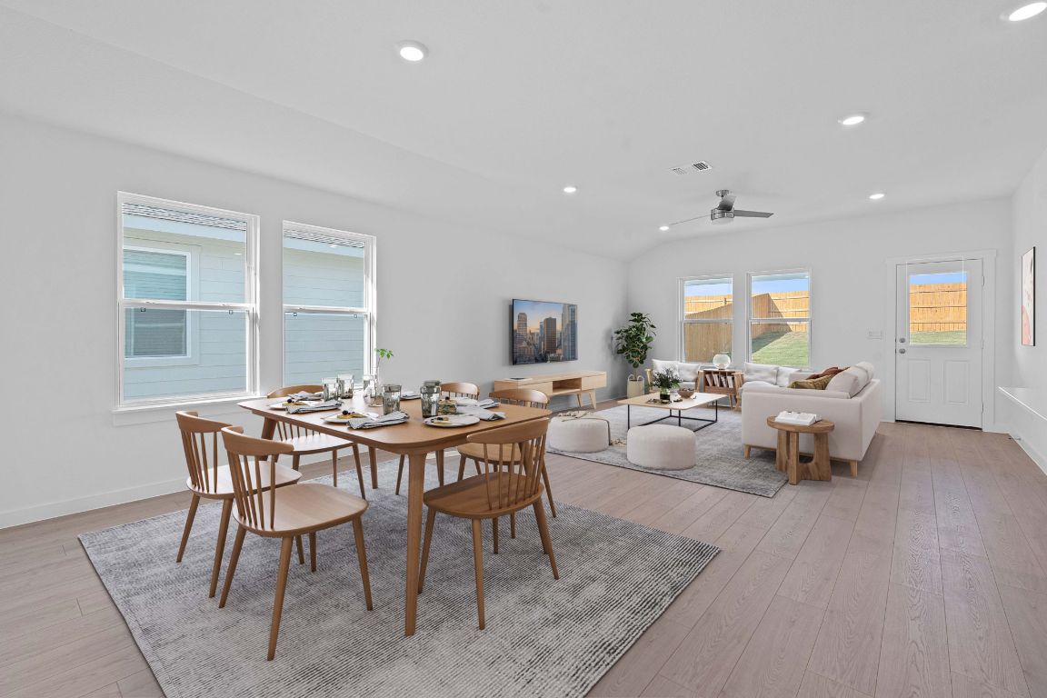 9701 Oxbow Strap Drive Austin, TX 78724 - Photo 5 of 34 Dining area with recessed lighting, light wood-style floors, a ceiling fan, and lofted ceiling