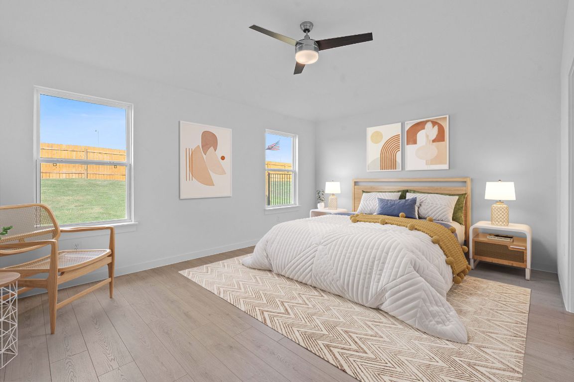 9701 Oxbow Strap Drive Austin, TX 78724 - Photo 7 of 34 Bedroom with wood finished floors and ceiling fan