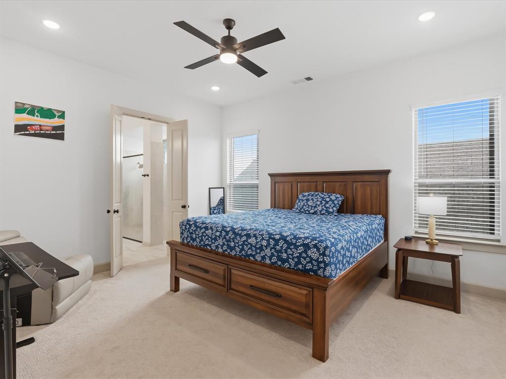 9533 Keep Street Frisco, TX 75035 - Photo 16 of 40 Bedroom featuring light-toned carpeting, dual windows with blinds, and recessed lighting