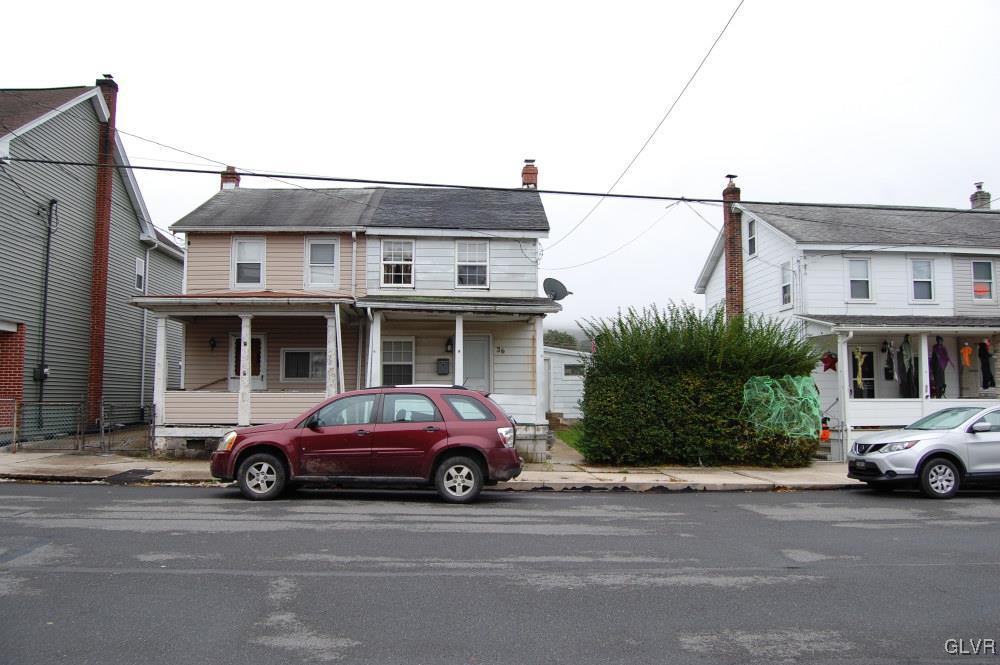 36 East Ruddle Street Coaldale, PA 18218 - Photo 1 of 16 a car parked in front of a house