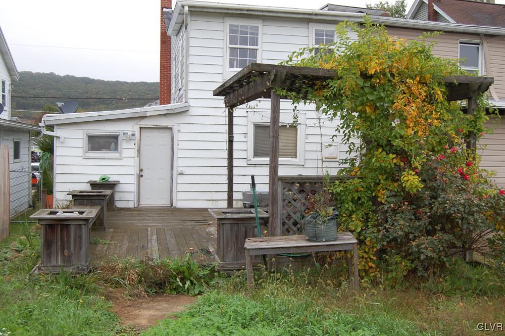 36 East Ruddle Street Coaldale, PA 18218 - Photo 15 of 16 a backyard of a house with table and chairs