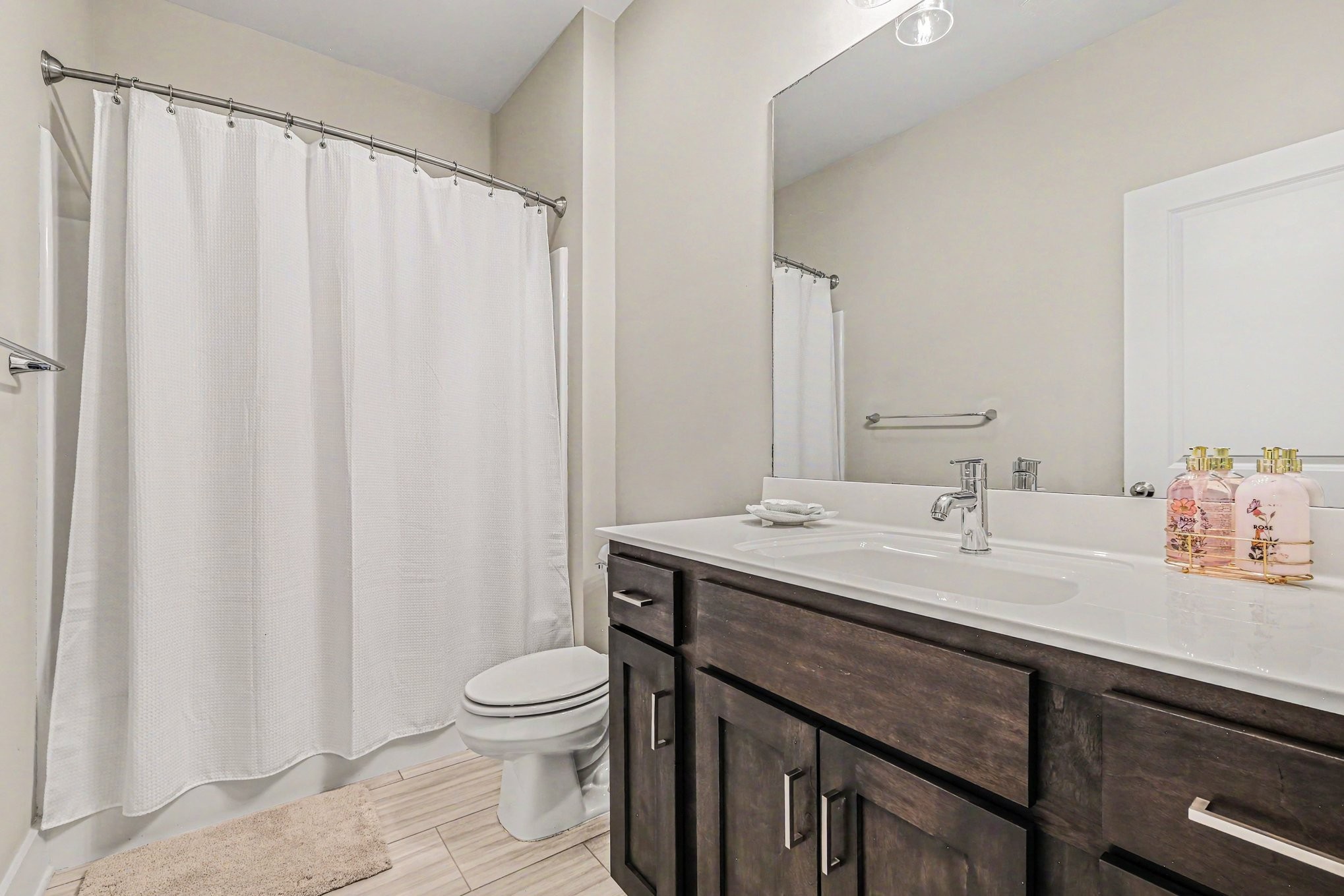 1144 Lock 4 Road, Unit H3 Gallatin, TN 37066 - Photo 15 of 22 a bathroom with a double vanity sink toilet and a mirror