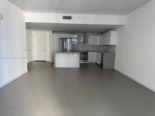 a view of kitchen and kitchen with furniture and counter space