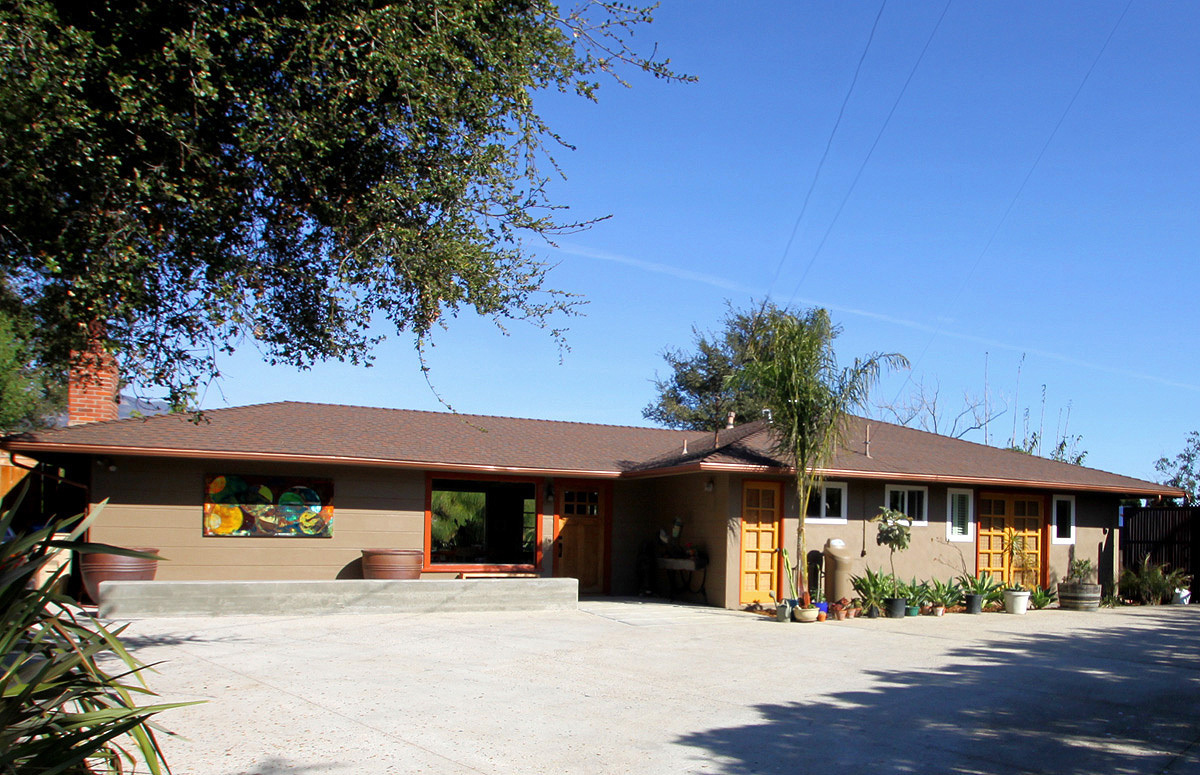 a front view of a house with a outdoor space