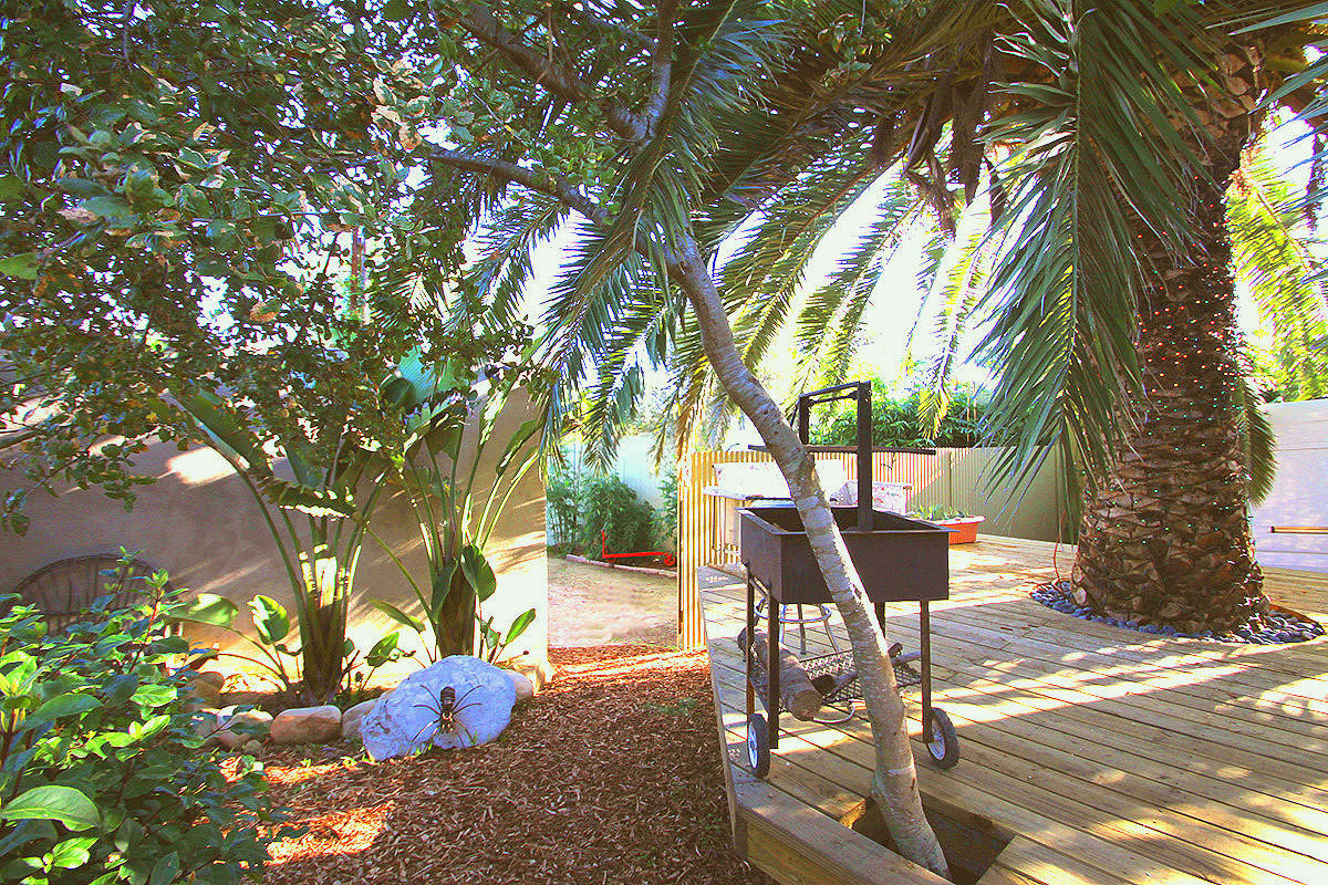 40 Pine Drive Santa Barbara, CA 93105 - Photo 15 of 30 a backyard view with table and chairs potted plants and a large tree