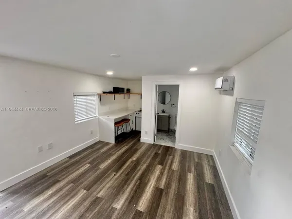 a view of a livingroom with wooden floor