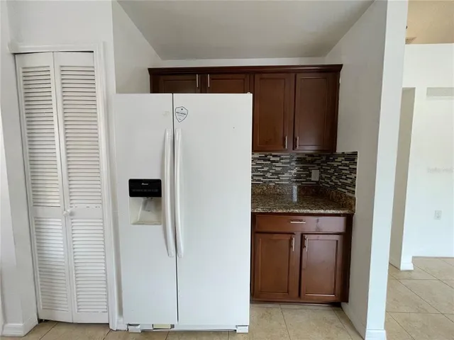 a kitchen with stainless steel appliances wooden cabinets and stove
