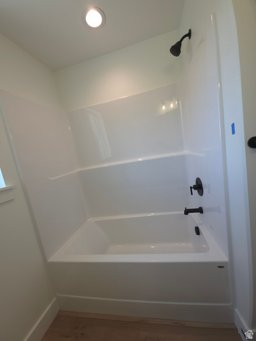 1267 West 2350 South Perry, UT 84302 - Photo 15 of 20 Bathtub and shower combination featuring a white surround, matte black fixtures, and recessed lighting