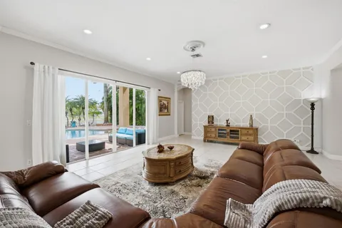 a living room with lots of furniture and a view of living room