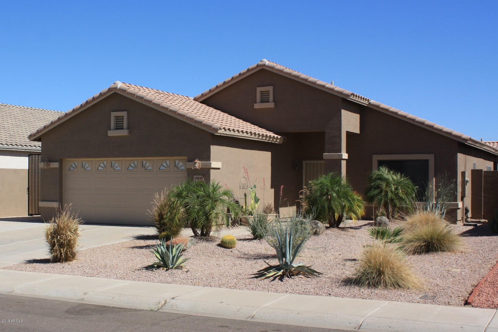 11816 West Windsor Avenue Avondale, AZ 85392 - Photo 3 of 19 a front view of a house with a yard