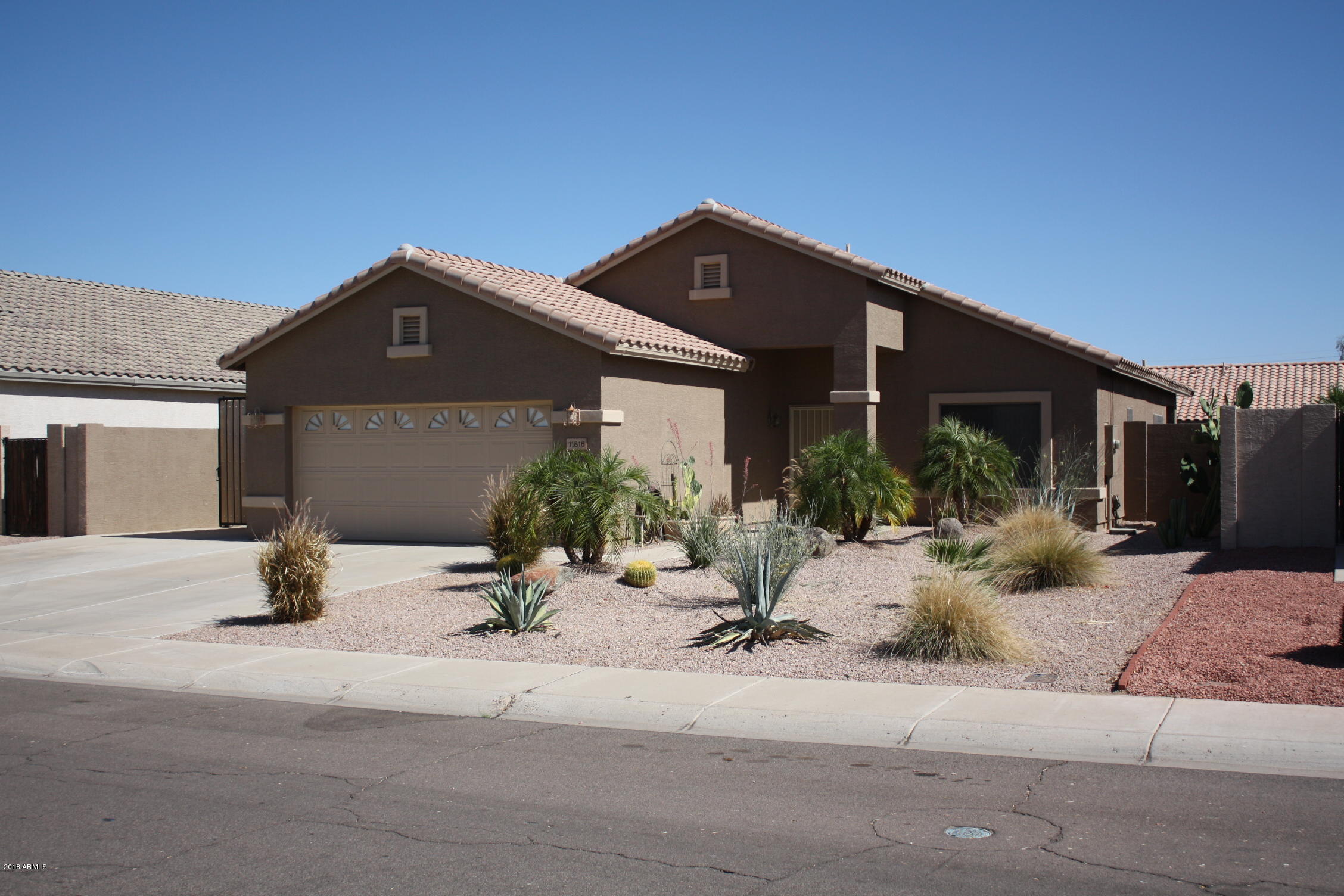11816 West Windsor Avenue Avondale, AZ 85392 - Photo 4 of 19 a view of a house with a patio