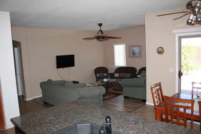a living room with furniture and a window