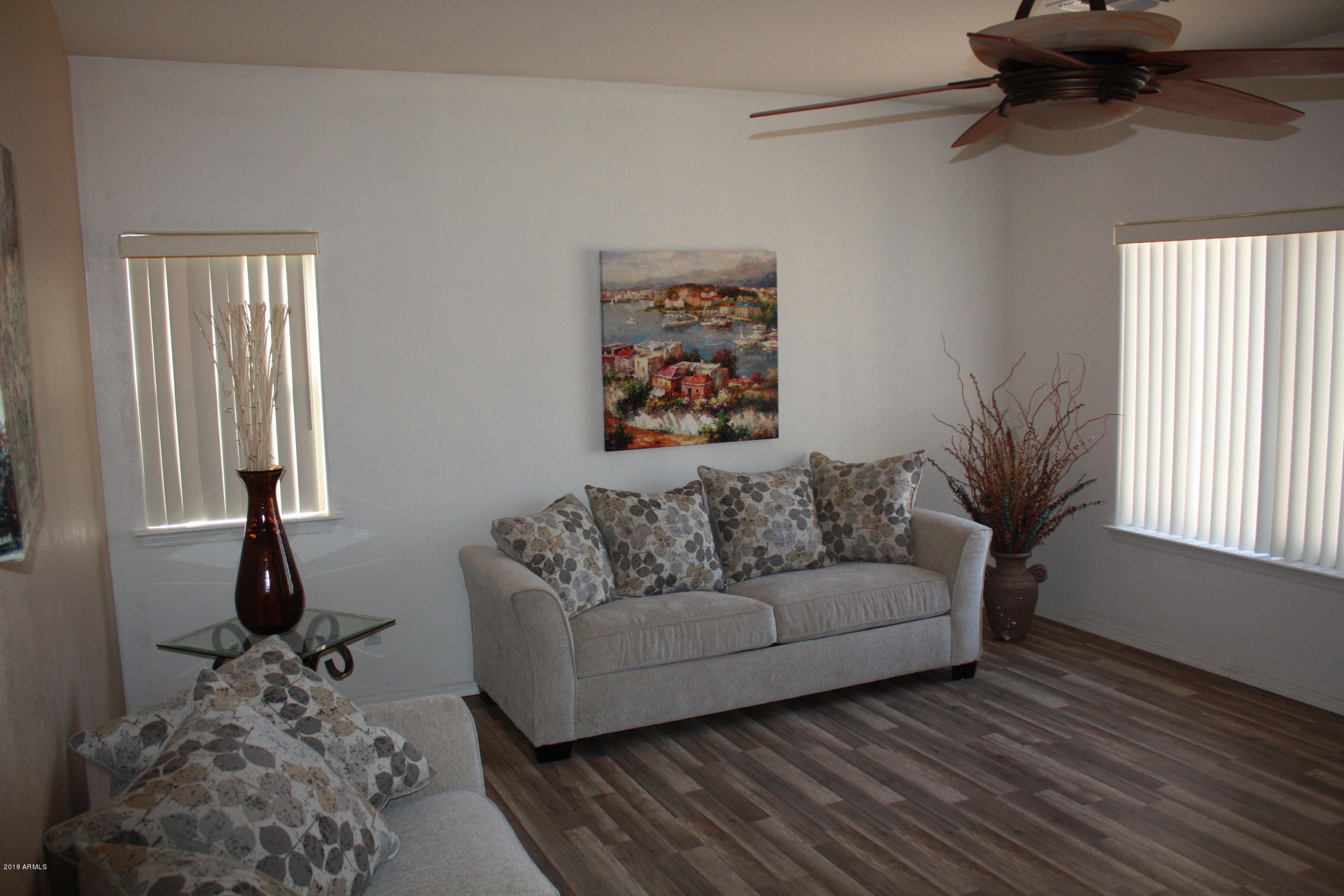 11816 West Windsor Avenue Avondale, AZ 85392 - Photo 10 of 19 a living room with furniture and a window