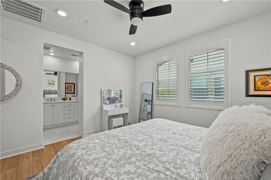 1663 Rosewell Road West Covina, CA 91791 - Photo 18 of 45 a bedroom with a bed and a chandelier
