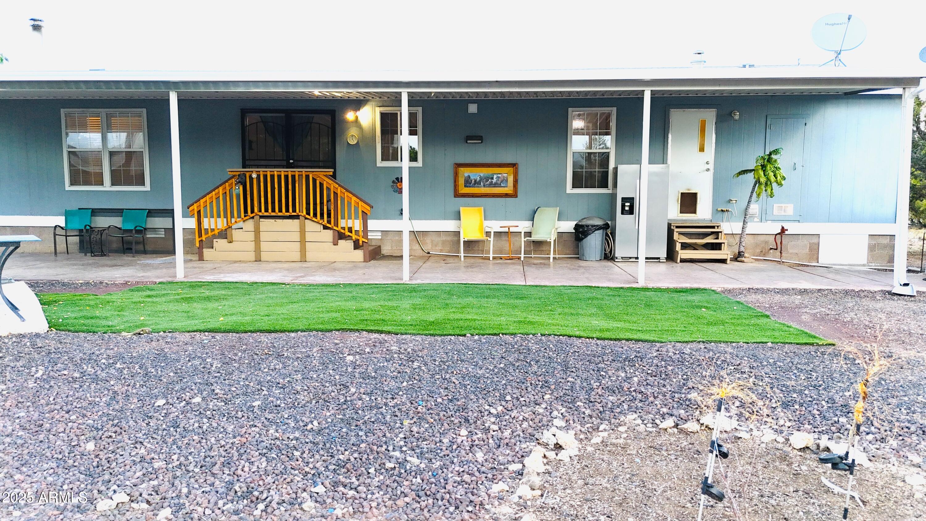 80 Acr 8050 Road Concho, AZ 85924 - Photo 8 of 32 a front view of a house with a yard and potted plants