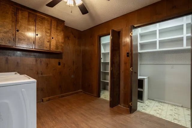 a view of a patio with table and chairs and wooden floor