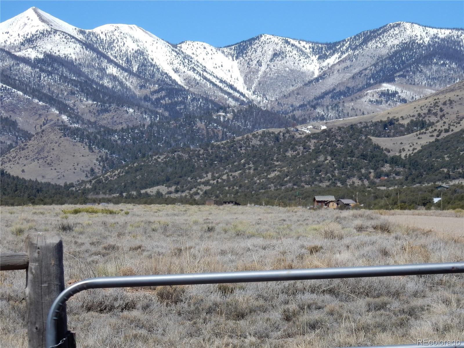 53975 County Rd LL56 Villa Grove, CO 81155 - Photo 1 of 11 a view of a dry yard with wooden fence