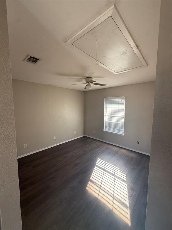 Undisclosed Address Dallas, TX 75238 - Photo 9 of 13 an empty room with wooden floor and windows