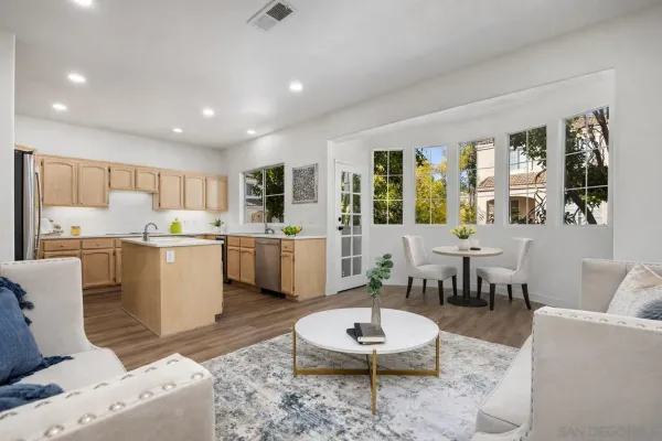 a large living room with furniture and a table