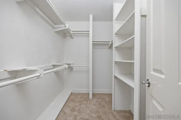 a view of an empty walk in closet