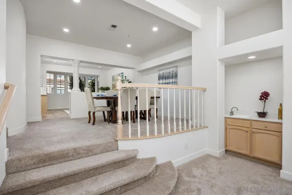 a living room with furniture and white walls