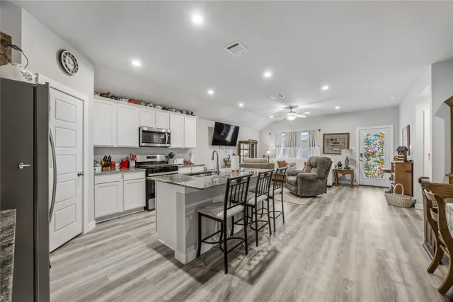 a kitchen with stainless steel appliances lots of counter top space