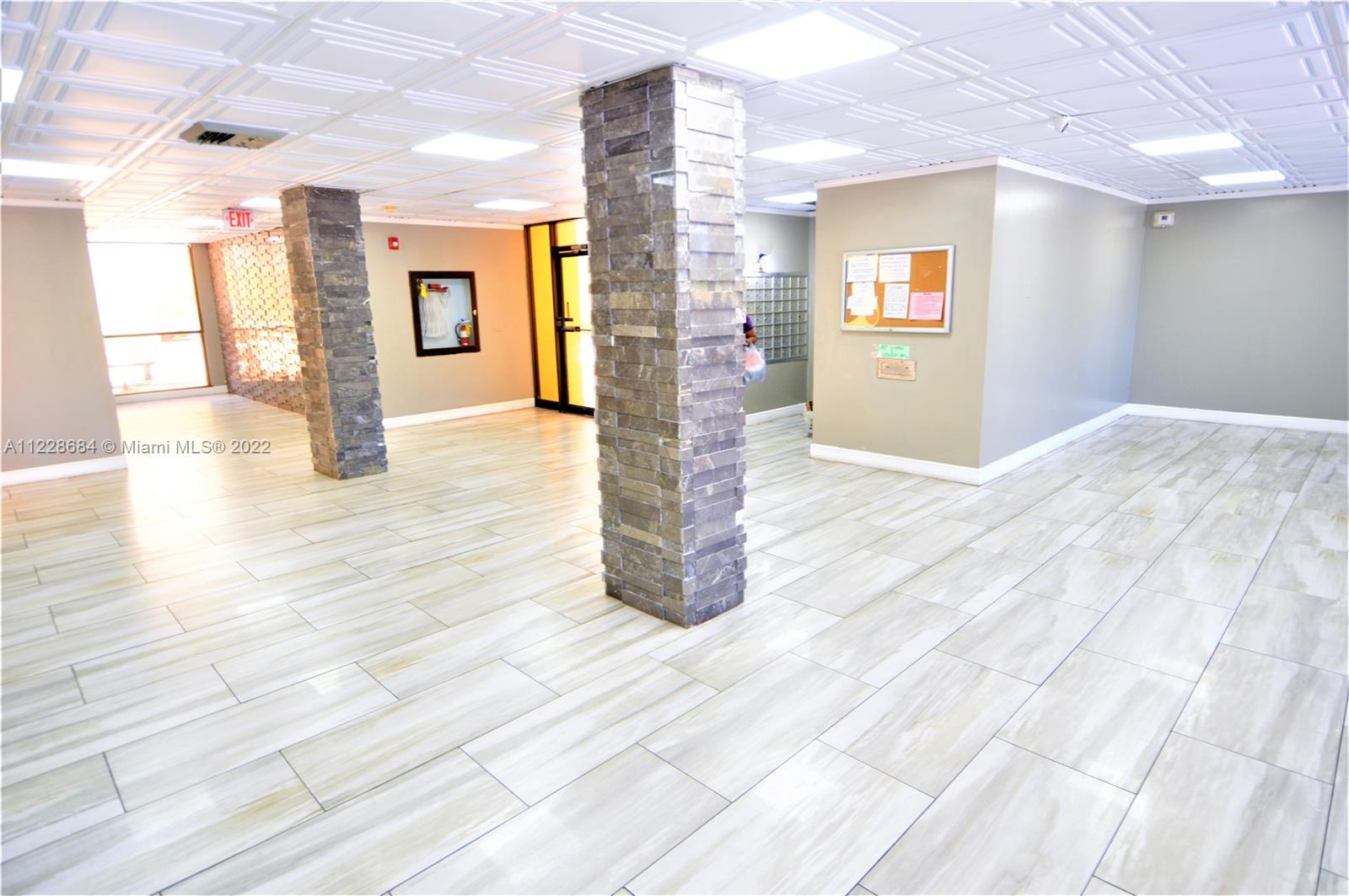 Golden Glades Miami, FL 33169 - Photo 14 of 17 a empty room with window and wooden floor