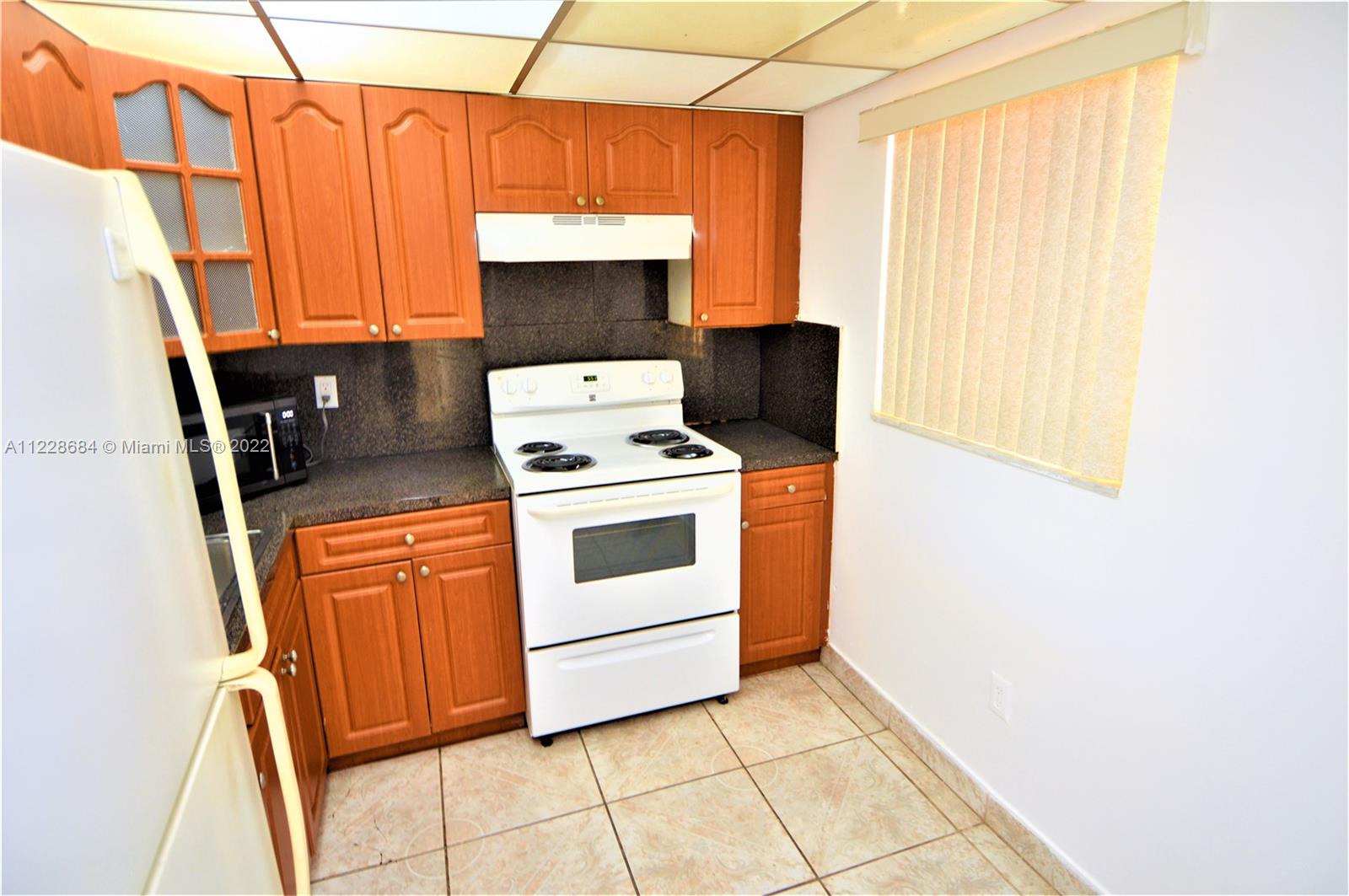 Golden Glades Miami, FL 33169 - Photo 3 of 17 a stove top oven sitting inside of a kitchen