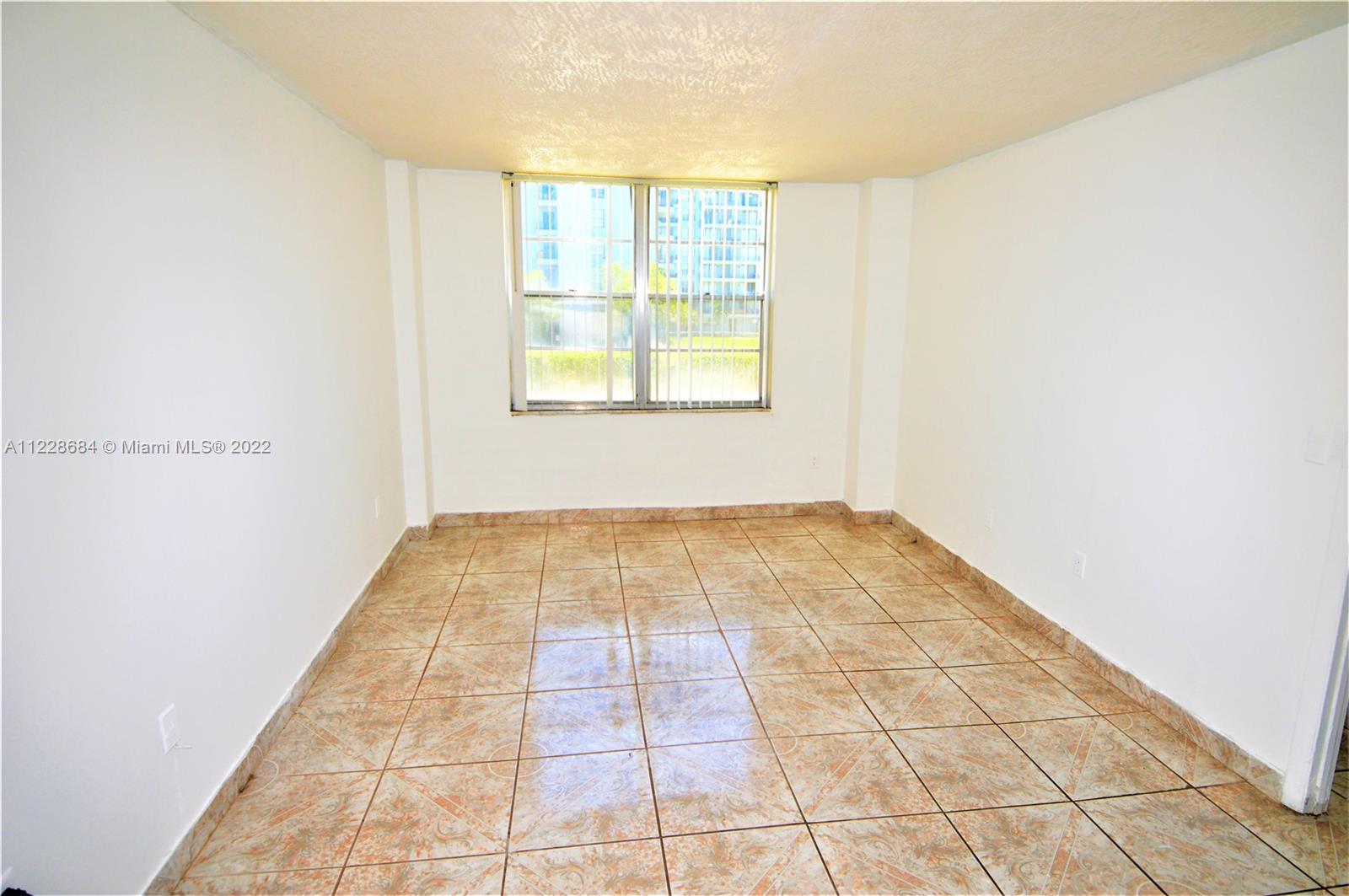 Golden Glades Miami, FL 33169 - Photo 6 of 17 en empty room with window
