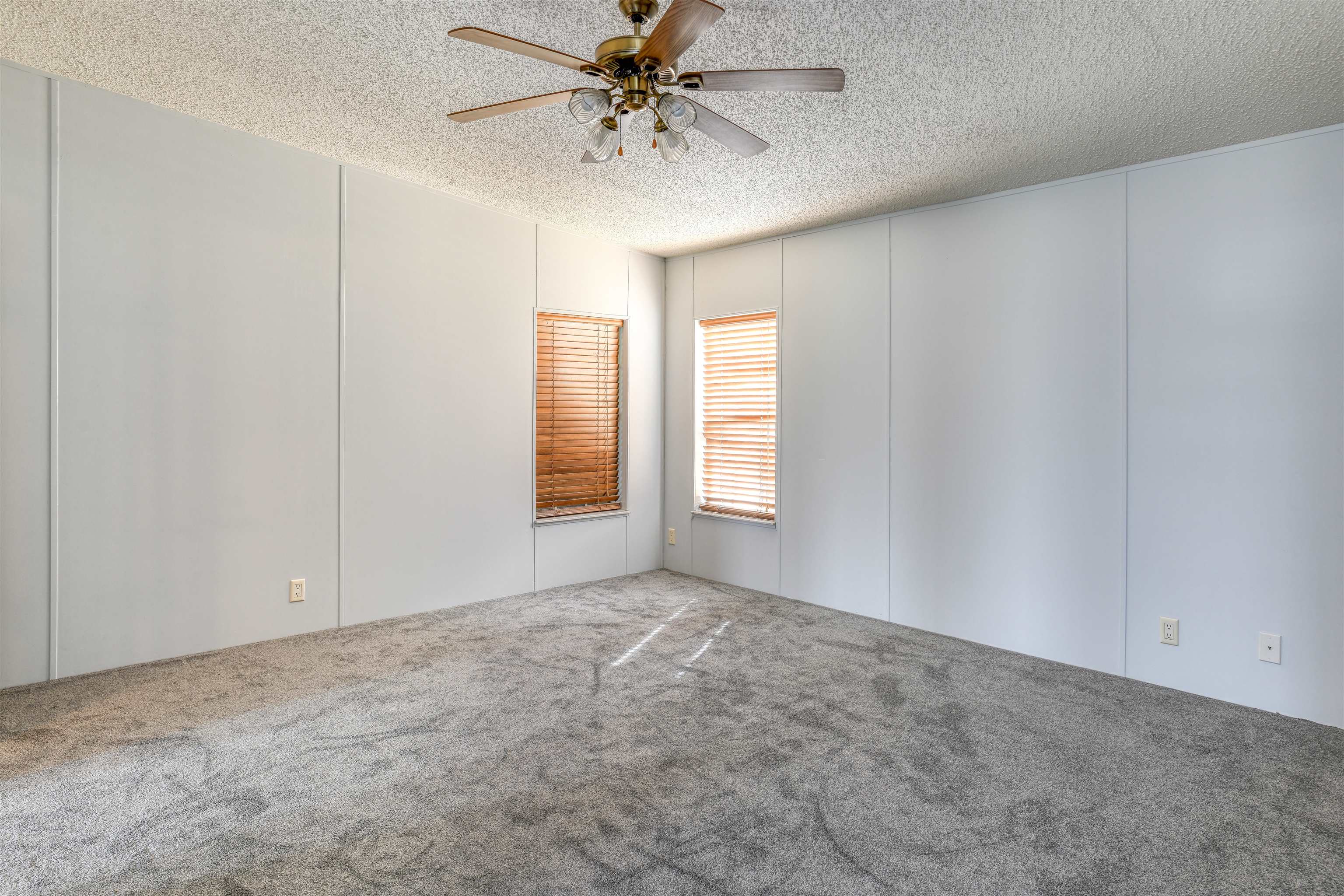 3170 Usina Road St. Augustine, FL 32084 - Photo 12 of 33 an empty room with windows and fan chandelier fan