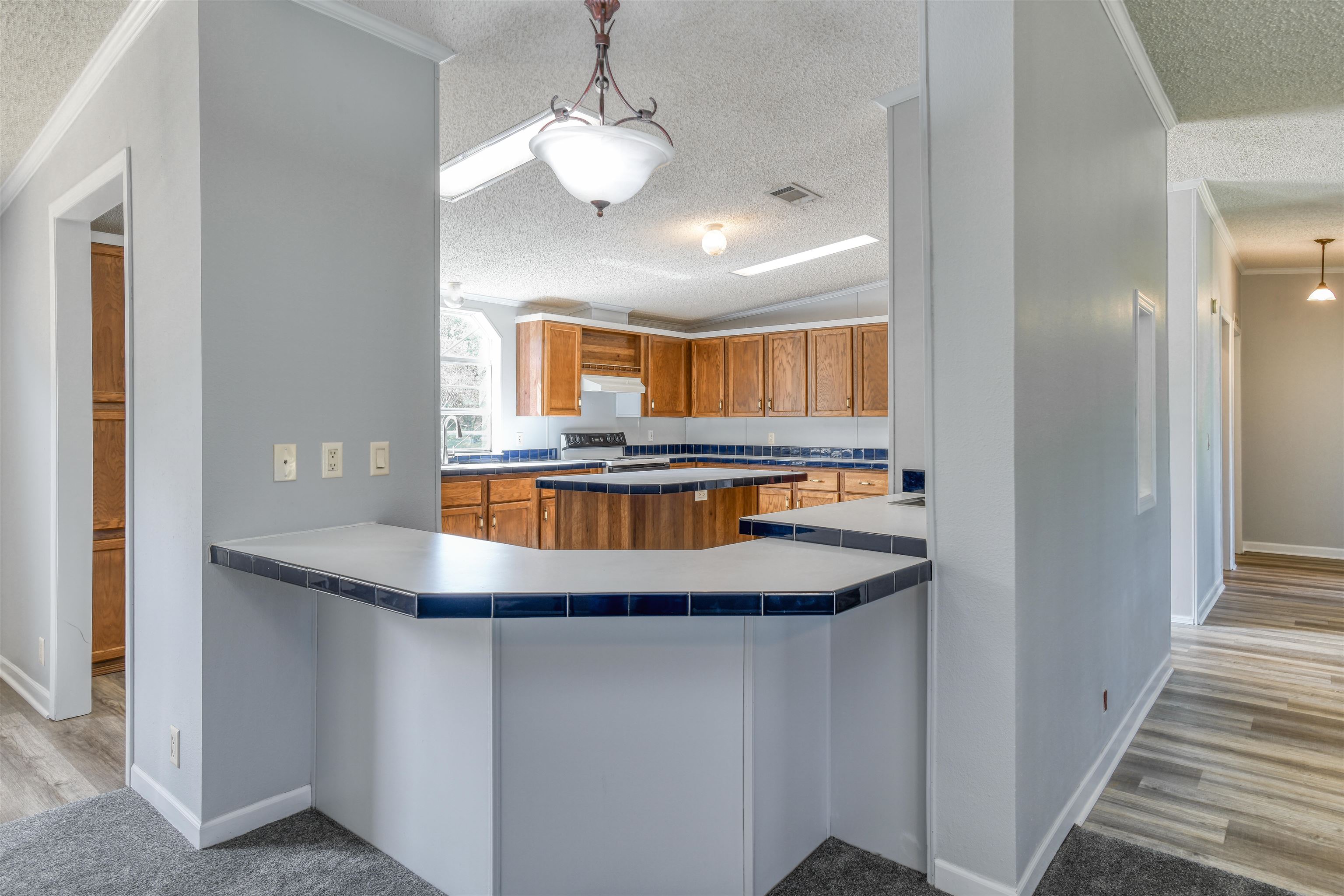 3170 Usina Road St. Augustine, FL 32084 - Photo 8 of 33 a kitchen with stainless steel appliances granite countertop a sink and a refrigerator
