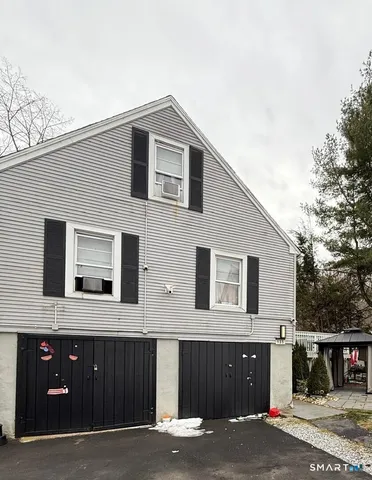 a front view of a house with parking space
