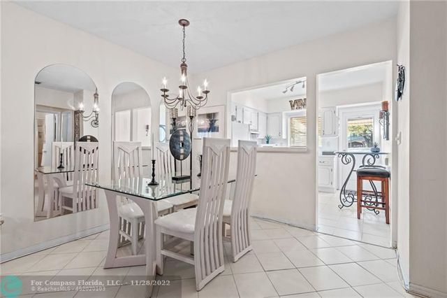 a view of a livingroom with furniture and a chandelier
