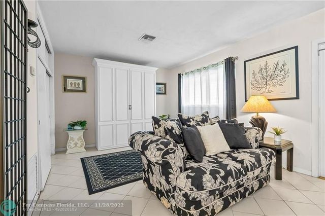 a living room with furniture or couch and a flat screen tv