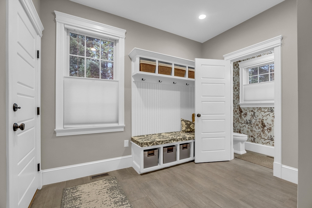 8 Holton Road Lexington, MA 02421 - Photo 15 of 42 a view of an empty room with wooden floor and a window