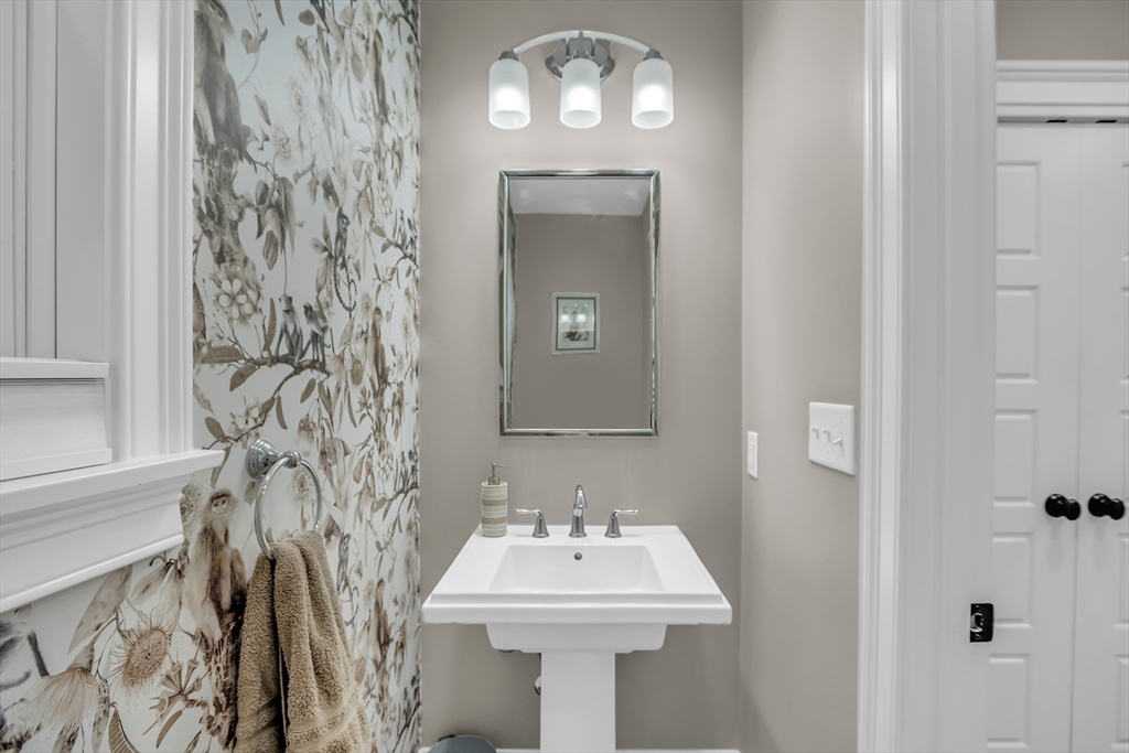 8 Holton Road Lexington, MA 02421 - Photo 16 of 42 a bathroom with a sink and a mirror