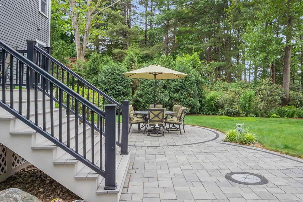 8 Holton Road Lexington, MA 02421 - Photo 37 of 42 a view of two chairs and table in the garden