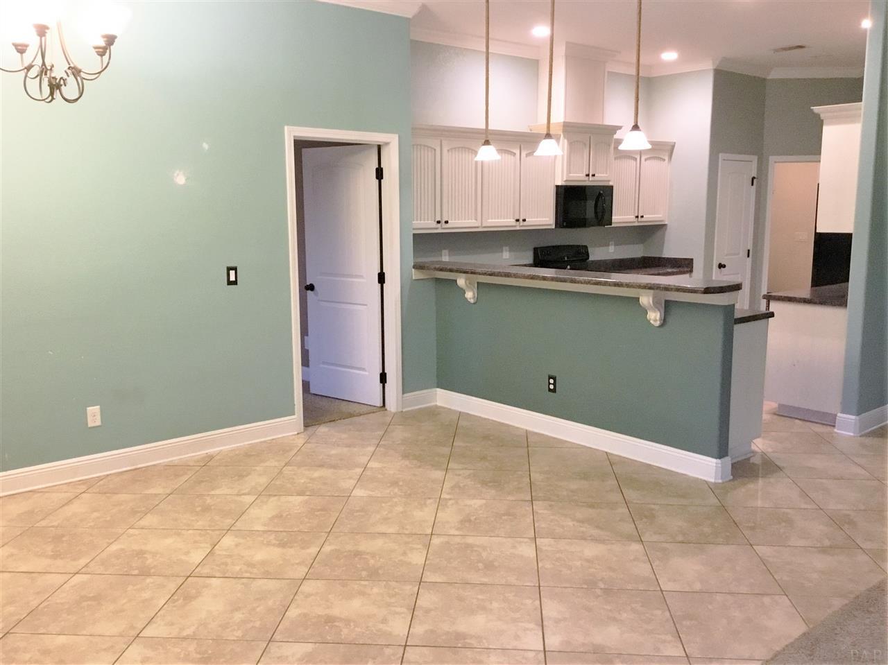 3839 Adams Road Pace, FL 32571 - Photo 11 of 27 Large dining space and breakfast bar.