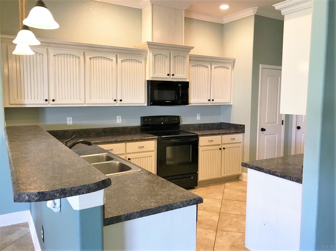 3839 Adams Road Pace, FL 32571 - Photo 5 of 27 Spacious kitchen with pantry.