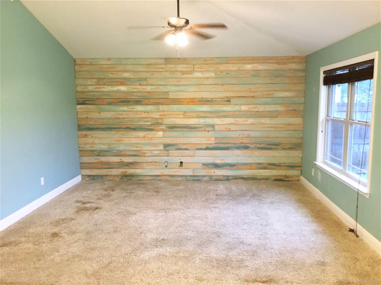 3839 Adams Road Pace, FL 32571 - Photo 10 of 27 Beautiful custom wood plank wall