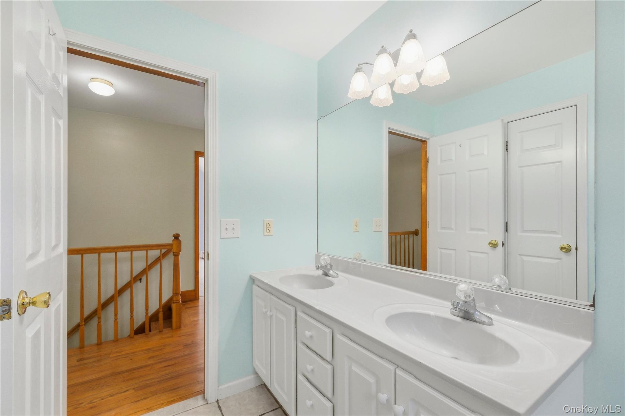 5 Horton Road Washingtonville, NY 10992 - Photo 24 of 42 a bathroom with a sink a light fixture and a mirror