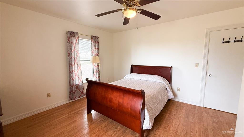 21713 North Western Road Edinburg, TX 78541 - Photo 11 of 24 Bedroom with light wood-style floors and a ceiling fan