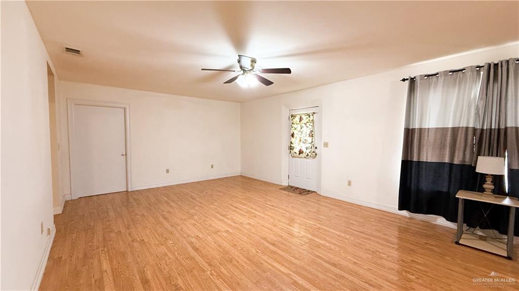 21713 North Western Road Edinburg, TX 78541 - Photo 6 of 24 Spare room featuring light wood-style flooring and ceiling fan